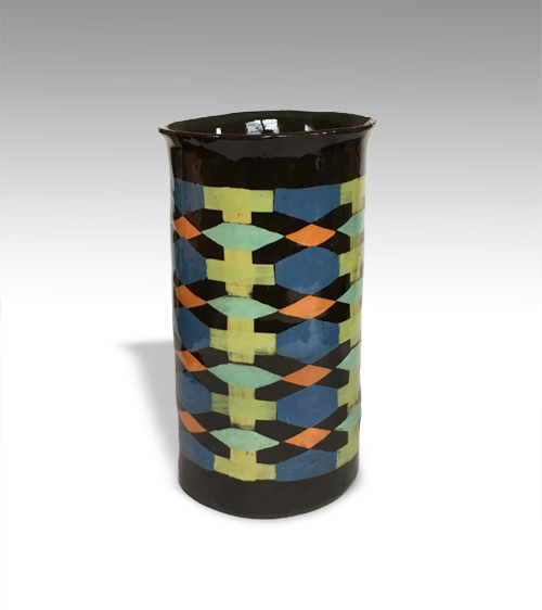 slab built cylinder with flared rim and multicolor geometric print on black