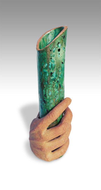 narrow green cylindrical vase hel as if it were a torch