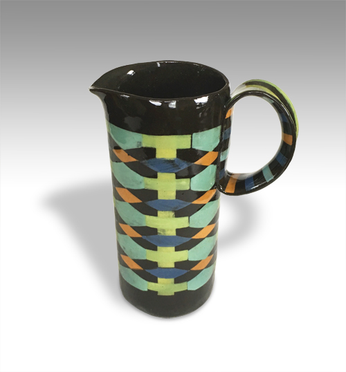 black pitcher with multi-color geometric print and high handle