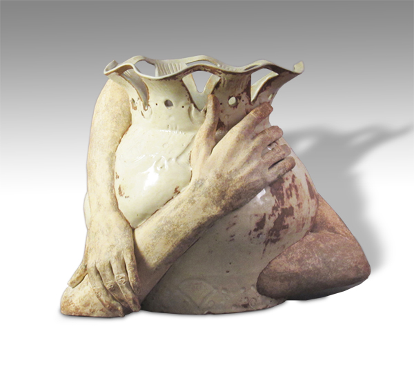 large vessel wrapped in arms and hands