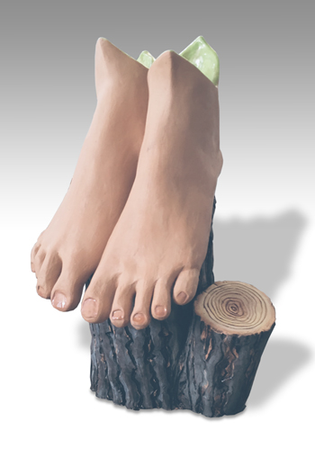 two human feet perched on a textured tree stump