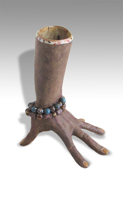 lower arm with bracelet perched on fingertips, with outrage as the emotional content