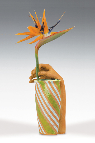 tall vase with hand to hold a single flower