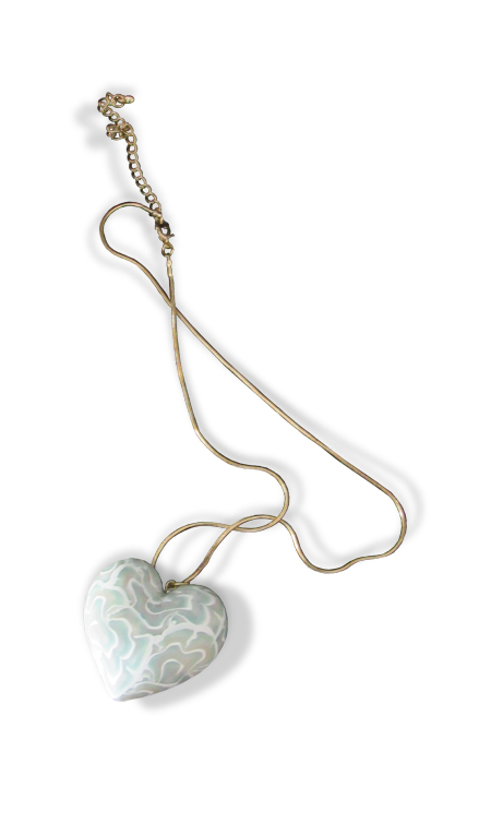 three dimensional aqua translucent and white polymer heart on a fine gold colored chain